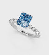 Platinum Fancy Blue Radiant Cut Diamond Solitaire Ring with Beaded Band and Prong Setting