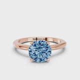 Rose gold Fancy Blue Round Cut Diamond Solitaire Ring with Six-Prong Setting and Classic Band
