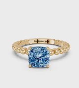 Yellow gold Fancy Blue Cushion Cut Diamond Solitaire Ring with Beaded Band and Prong Setting