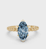 Yellow gold Fancy Blue Marquise Cut Diamond Solitaire Ring with Beaded Band and Prong Setting