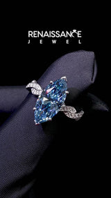 White gold Fancy Blue Marquise  Cut Twisted Pavé Band Solitaire Ring with Four-Prong Setting
