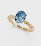 Yellow gold Fancy Blue Oval Cut Diamond Solitaire Ring with Beaded Band and Prong Setting