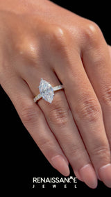 Yellow gold Marquise Cut Diamond Solitaire with Side Baguettes and Channel Set Band