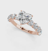 Rose gold Heart Cut Diamond Prong Setting with Side Stones on a Pave Band