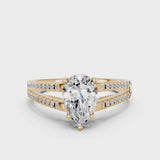 Yellow gold Pear Cut Diamond Solitaire Engagement Ring with Split Shank Pavé Band