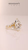 Yellow gold Marquise Diamond Solitaire with Side Stones on a White Gold Band and Four-Prong Setting_19