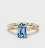 Yellow gold Fancy Blue Emerald Cut Diamond Solitaire Ring with Six-Prong Setting and Classic Band