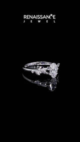 White gold Oval Cut Diamond Solitaire Ring with Leaf Motif Band and Four-Prong Setting