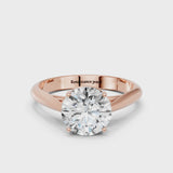 Rose gold Round Cut Diamond Solitaire Engagement Ring with Cathedral Setting and Four-Prong Mount