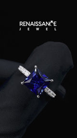 Silver Princess Cut Blue Sapphire Solitaire Ring with Round  Pavé Band and Prong Setting