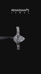 Rose gold Pear Cut Diamond Solitaire with Side Baguettes and Channel Set Band