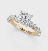 Yellow gold Princess Cut Diamond Prong Setting with Side Stones on a Pave Band
