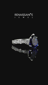 Silver Pear Cut Blue Sapphire Side Stone Solitaire Ring with Round  and Four-Prong Setting