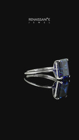 Silver Emerald Cut Blue Sapphire Solitaire Engagement Ring with Round Band and Four-Prong Setting