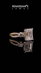 Yellow gold Emerald Cut Diamond Three-Stone Ring with Pavé Split Shank and Four-Prong Setting
