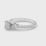 White gold Oval Cut Diamond Solitaire Ring with Four-Prong Setting and Twisted Pavé Band