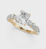 Yellow gold Radiant Cut Diamond Prong Setting with Side Stones on a Pave Band