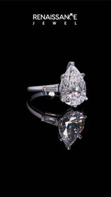 Silver Pear Solitaire with Tapered Baguette Side Stones on a Classic Band with Six-Prong Setting