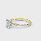 Yellow gold Radiant Cut Diamond Ring with Marquise Side Stones and Prong Setting
