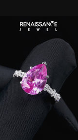 Silver Pear Cut Pink Sapphire Side Stone Solitaire Ring with Round and Four-Prong Setting