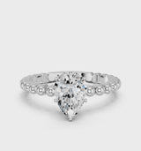 Platinum Pear Cut Diamond Solitaire Ring with Beaded Band and Prong Setting