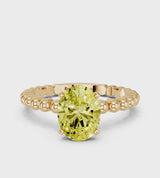 Yellow gold Fancy Yellow Oval Cut Diamond Solitaire Ring with Beaded Band and Prong Setting