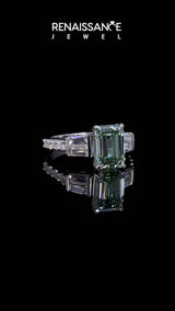 White gold Fancy Green Emerald Cut Diamond Engagement Ring with Baguette Side Stones and Channel Set Band