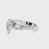 White gold Pear Cut Diamond Engagement Ring with Baguette Side Stones and Channel Set Band