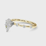 Yellow gold Pear Solitaire Diamond Ring with Bezel Set Side Stones and Prong Setting