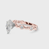 Rose gold Pear Solitaire Bezel-Set Diamond Ring with Beaded Band and Four-Prong Setting