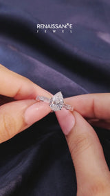 Rose gold Pear Cut Diamond Solitaire with Side Baguettes and Channel Set Band