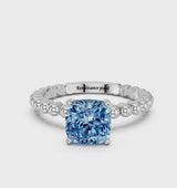 White gold Fancy Blue Cushion Cut Diamond Solitaire Ring with Beaded Band and Prong Setting
