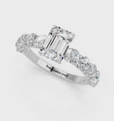 Platinum Emerald Cut Diamond Prong Setting with Side Stones on a Pave Band