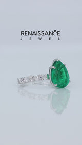 Silver Pear Cut Emerald Side Stone Solitaire Ring with Round and Four-Prong Setting