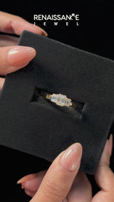 Yellow gold Three-Stone Emerald Cut Diamond Ring with Channel Set Band and Four-Prong Setting