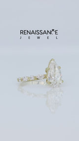 Yellow gold Pear Cut Diamond Ring with Marquise and Round  Side Stones and Four-Prong Setting