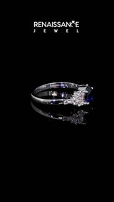 Silver Oval Cut Blue Sapphire Ring with Side Stones and Four-Prong Setting
