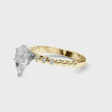 Yellow gold Pear Solitaire Bezel Accent Diamond Engagement Ring with Beaded Band and Four-Prong Setting