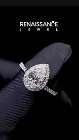 White gold Pear Cut Diamond Halo Engagement Ring with Pavé Band and Prong Setting