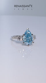 White gold Three-Stone Fancy Blue Pear Cut Diamond Pavé Band with Four-Prong Setting