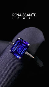 Silver Emerald Cut Blue Sapphire Solitaire Engagement Ring with Round Band and Four-Prong Setting
