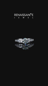 White gold Pear Brilliant Solitaire with Side Stones on a Pave Band and Four-Prong Setting