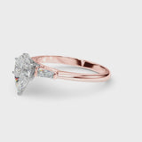 Rose gold Pear Solitaire with Tapered Baguette Side Stones on a Classic Band with Six-Prong Setting