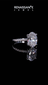 White gold Oval Cut Diamond Solitaire Ring with Round  Pavé Band and Prong Setting