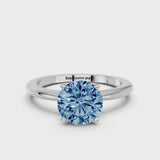 White gold Fancy Blue Round Cut Diamond Solitaire Ring with Six-Prong Setting and Classic Band