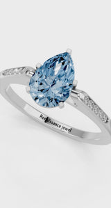 White gold Fancy Blue Pear  Cut Channel Set Solitaire Engagement Ring with Four-Prong Setting