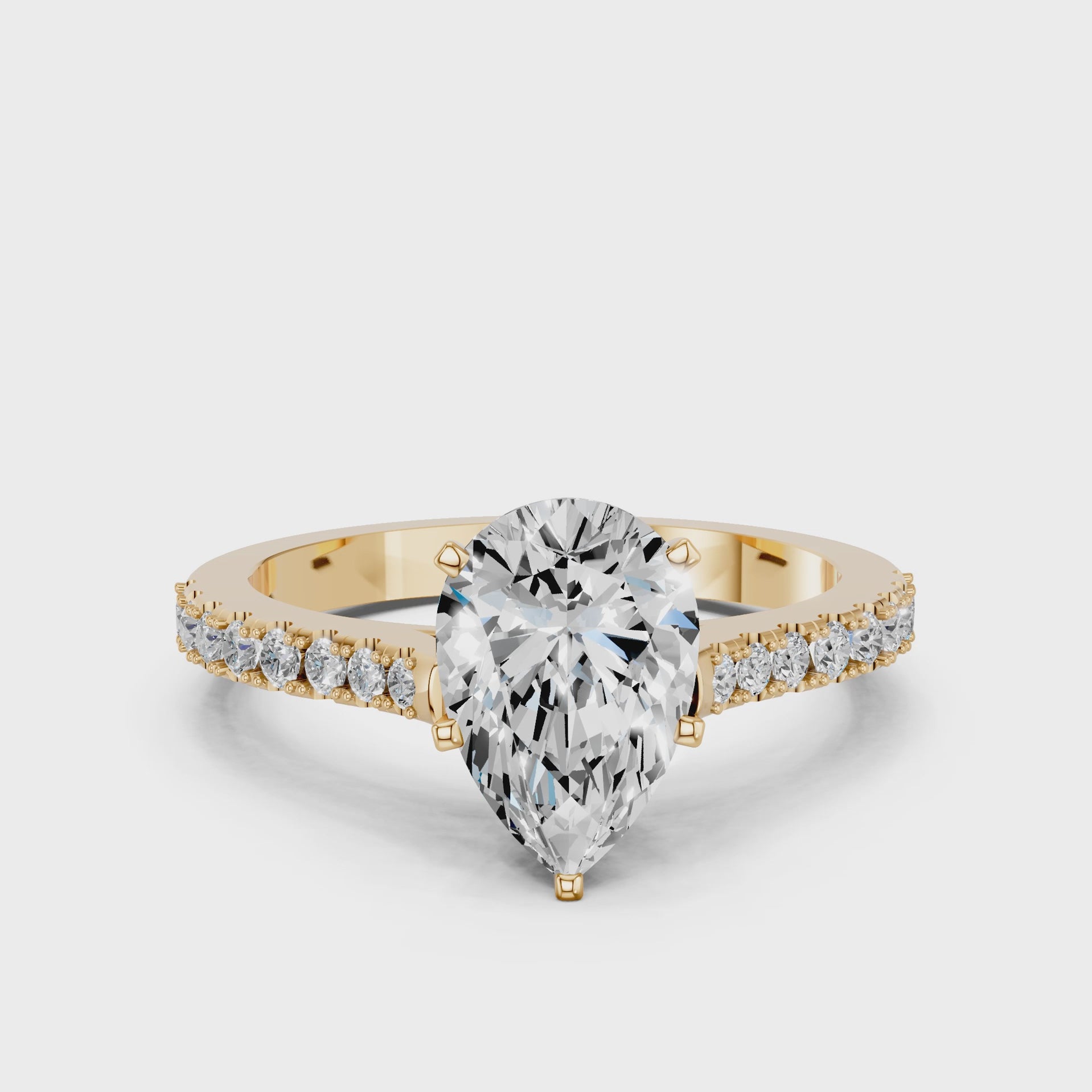 Yellow gold Pear Cut Solitaire Diamond Engagement Ring with Pave Band and Four-Prong Setting_89
