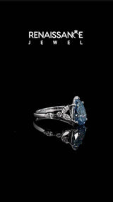 White gold Fancy Blue Pear Cut Diamond Solitaire Ring with Side Stones and Four-Prong Setting