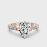 Rose gold Pear Cut Solitaire Diamond Engagement Ring with Pave Band and Four-Prong Setting
