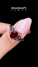 Platinum Oval Cut Ruby Solitaire Celtic Knot Ring with Four-Prong Setting